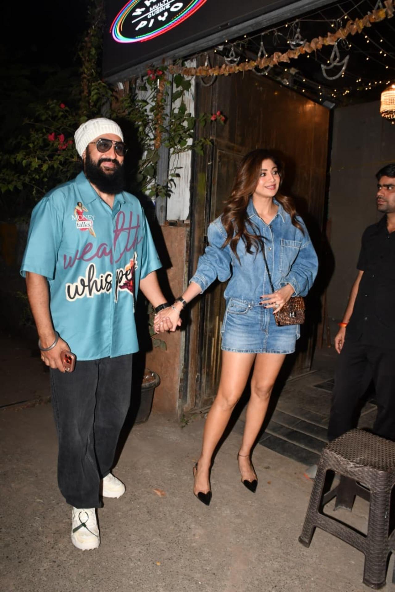 Shilpa Shetty and Raj Kundra were spotted stepping out for a date night in Bandra hand-in-hand. Shilpa wore a denim mini-skirt with a denim shirt, while Raj wore a jersey with black pants.